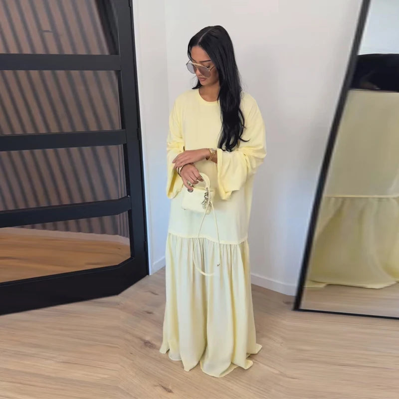Brisa Aire — vestido largo fluido con plisados, manga corta y diseño patchwork elegante