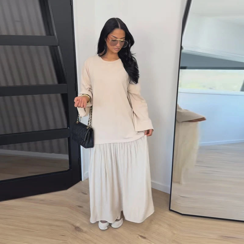 Brisa Aire — vestido largo fluido con plisados, manga corta y diseño patchwork elegante